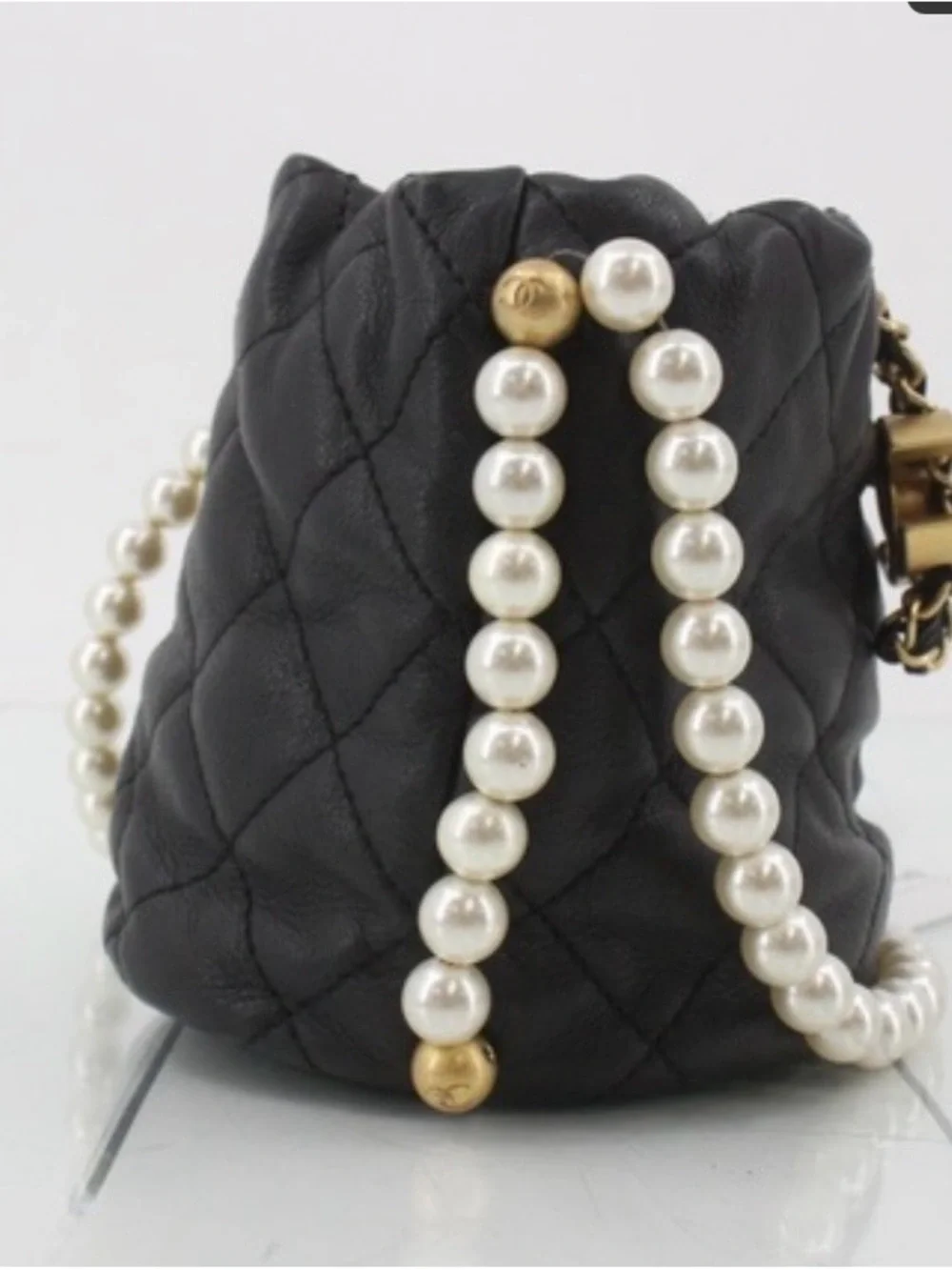 CHANEL Pearl Drawstring Bucket Bag in Black Quilted Lambskin with Pearl Strap